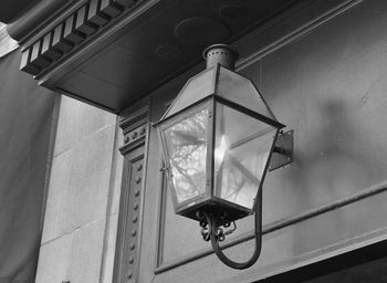 Low angle view of electric lamp hanging on ceiling