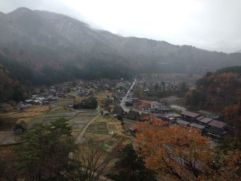 High angle view of townscape against mountain