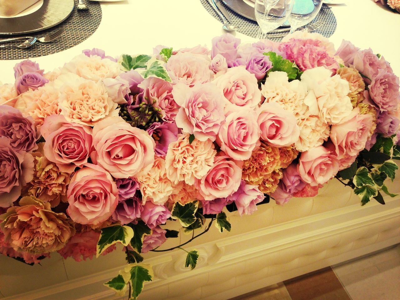 freshness, flower, indoors, petal, table, still life, bouquet, close-up, food, fragility, food and drink, vase, high angle view, flower head, rose - flower, bunch of flowers, pink color, beauty in nature, variation, flower arrangement