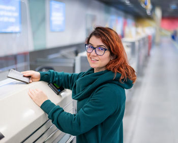 Portrait of young woman using smart phone