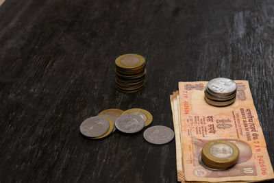 High angle view of coins on table