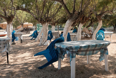 Empty chairs on beach