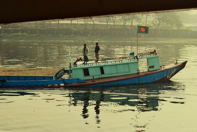 Boat moored on sea against sky