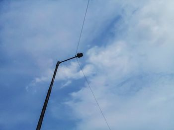 Low angle view of power line against sky