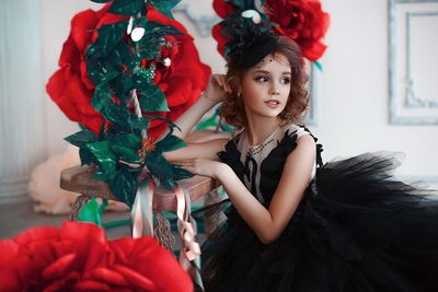 Portrait of woman with red roses