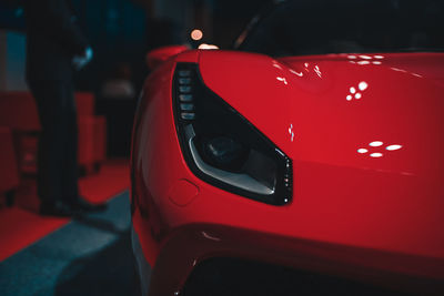 Close-up of red car on street