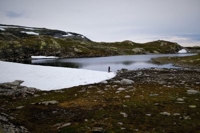 Scenic view of frozen lake against sky