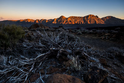 Scenic view of rock formations against sky during sunset