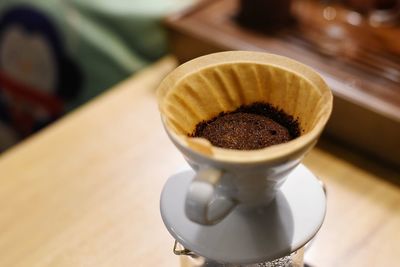 Close-up of coffee cup on table