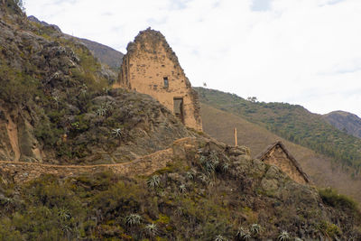 Old ruins of building against cloudy sky