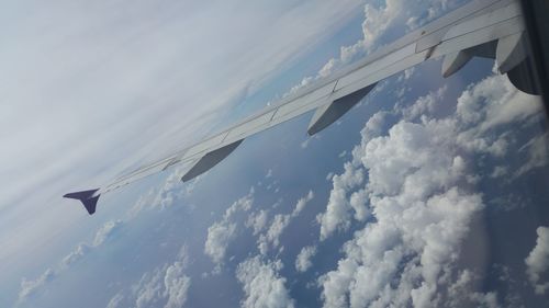 Low angle view of airplane flying in sky