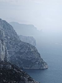 Scenic view of mountains in foggy weather