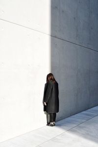 Full length of woman standing on street