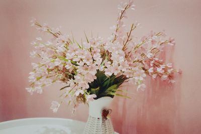 Close-up of white flower pot on table
