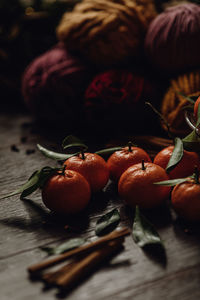 Christmas - mandarin oranges, cinnamon and pine cones, christmas tree lights