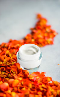 Close-up of pills spilling from bottle