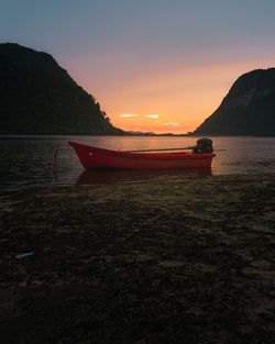 Scenic view of lake against sky during sunset