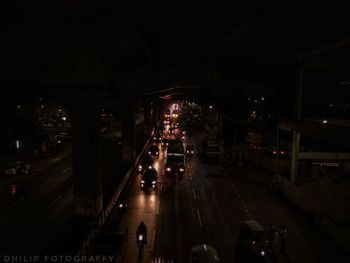 Traffic on road in city at night