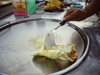 Midsection of person preparing food on table