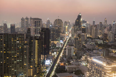 High angle view of illuminated buildings in city against sky