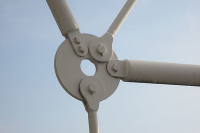 Low angle view of telephone pole against clear sky