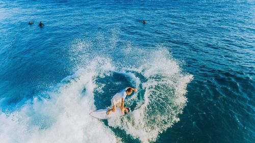 High angle view of man surfing in sea