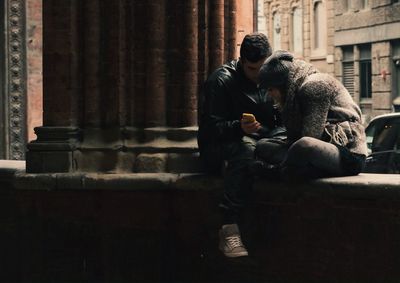 Full length of woman standing by railing