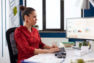 Businesswoman working on computer at office