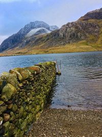 Scenic view of lake and mountains against sky