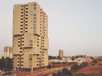 Modern buildings against sky in city