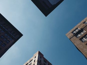 Low angle view of skyscraper against clear sky