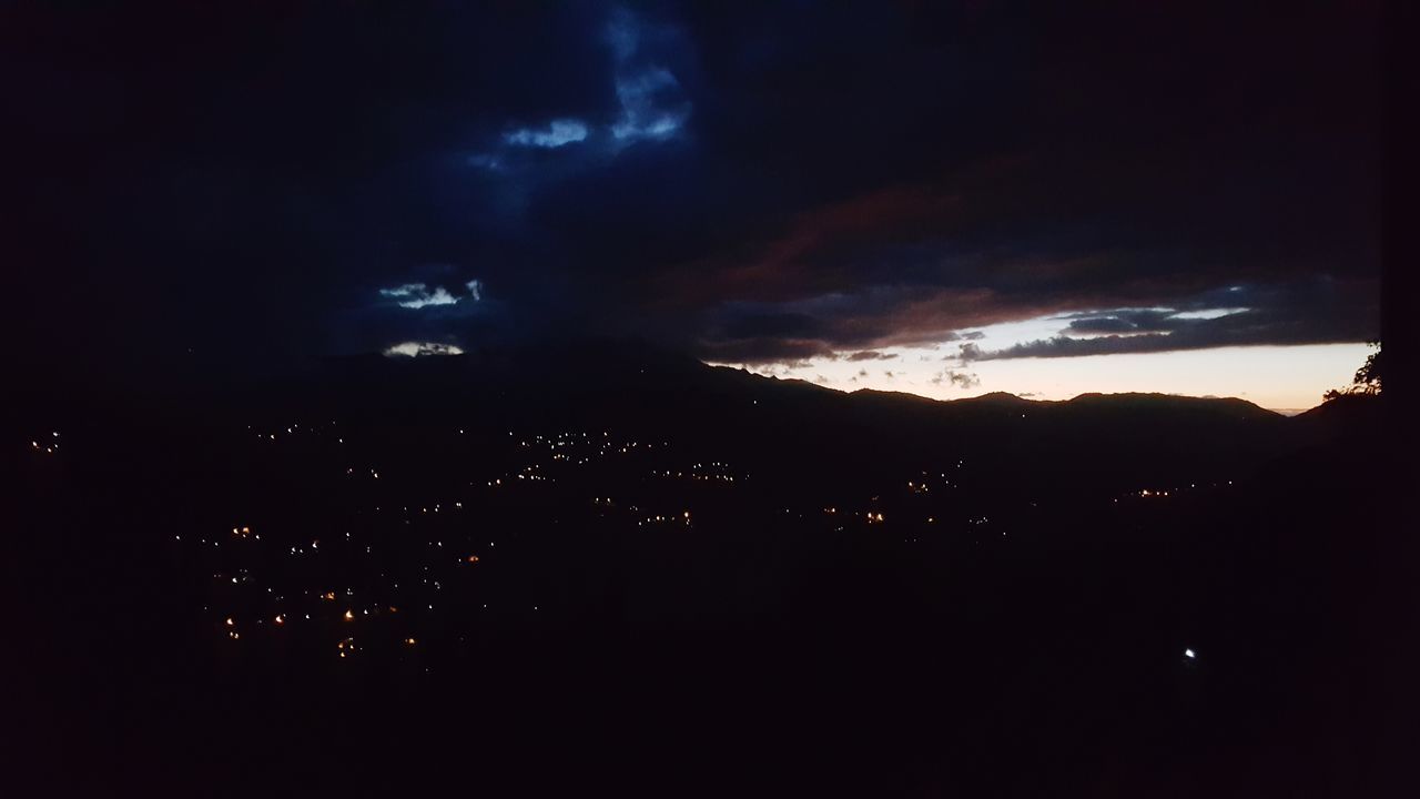 sky, cloud - sky, night, no people, silhouette, beauty in nature, nature, illuminated, scenics - nature, dark, architecture, environment, outdoors, building exterior, city, tranquil scene, tranquility, cityscape, mountain