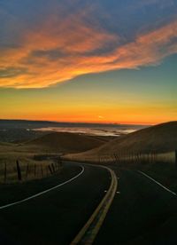 Empty road at sunset