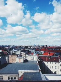 Buildings against cloudy sky