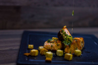 Close-up of serving food on table