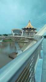 Bridge over river against building