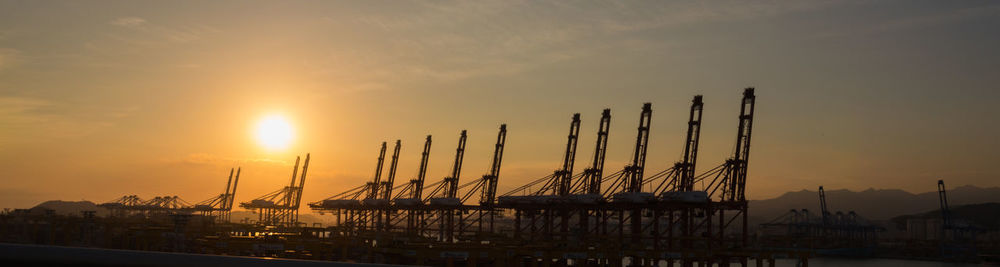 It's magnificent to see cranes lining the industrial port.