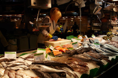 Woman selling fish at market