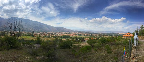 Scenic view of mountains against cloudy sky