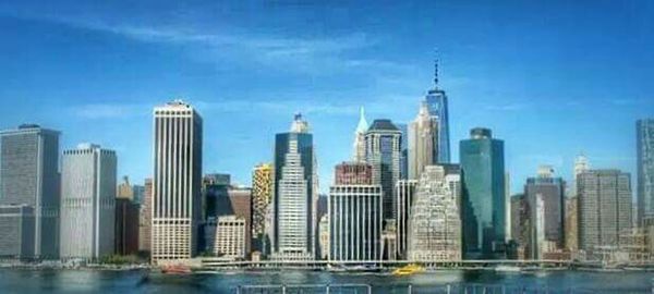 City skyline against cloudy sky