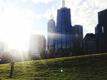 Buildings in city against sky