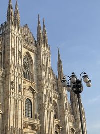 Low angle view of statue against sky