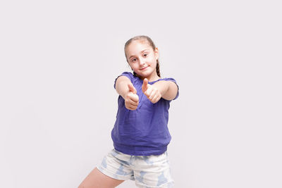 Portrait of smiling girl against white background