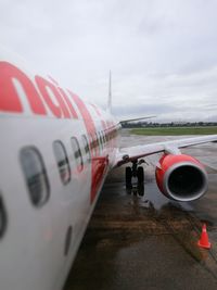Airplane wing against sky