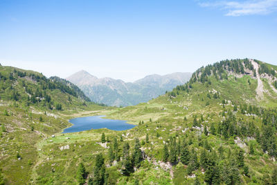 Scenic view of mountains against clear blue sky