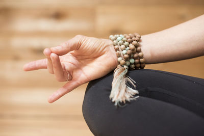 A girls hand in mudra during meditation.