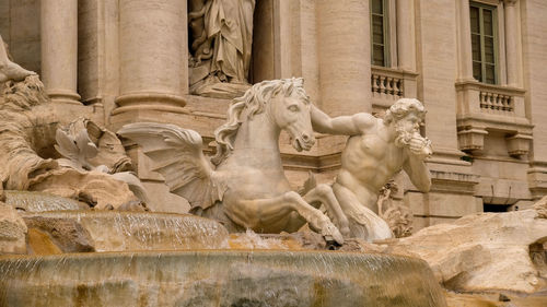 Statue in front of historic building