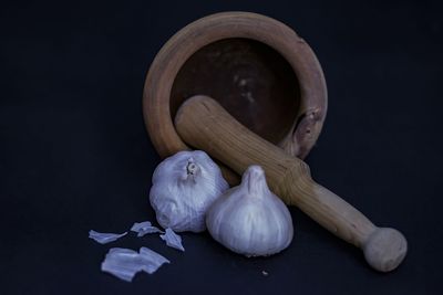 Close-up of garlic on white table