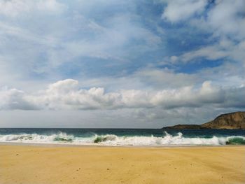 Scenic view of beach against sky