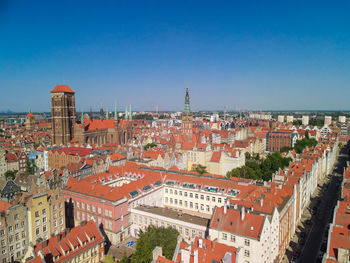 High angle view of townscape against blue sky
